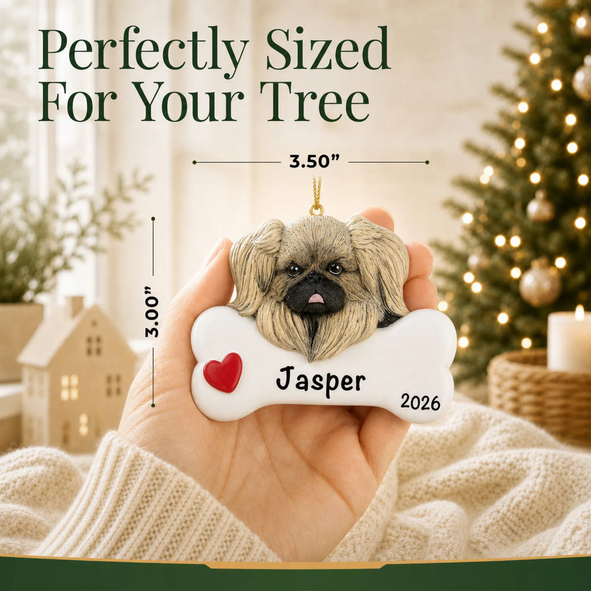 Hand holding the personalized Pekingese Christmas ornament to show its 3.50 inch width