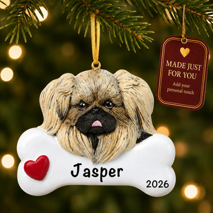 Personalized Pekingese Christmas ornament hanging on a lit tree beside a Made Just For You tag