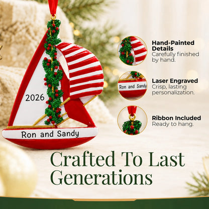 Hand-painted details and laser engraved personalization on the red sailboat christmas ornament, ribbon included
