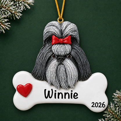 Personalized Shih Tzu dog bone Christmas ornament, engraved with a name and year, on a green holiday backdrop