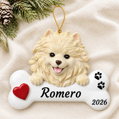 Personalized Pomeranian Dog Bone christmas ornament laid on a soft white knit blanket