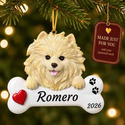 Pomeranian Dog Bone christmas ornament hanging on a lit Christmas tree with a Made Just For You gift tag