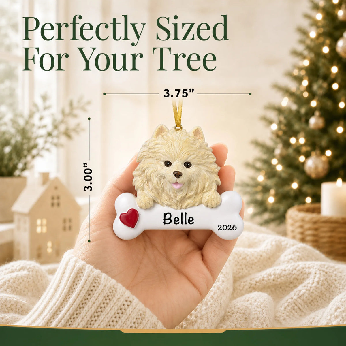 Hand holding the personalized Pomeranian Christmas ornament to show its 3.75 inch width