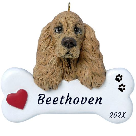 Personalized cocker spaniel dog bone Christmas ornament, a buff cocker with long ears on a white bone, name and year