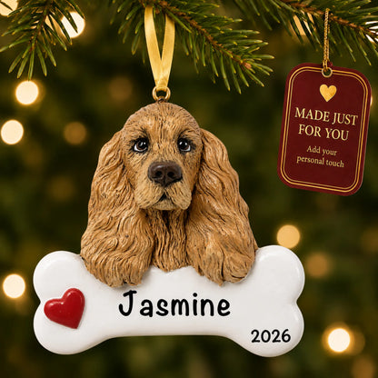 Personalized cocker spaniel Christmas ornament hanging on a lit tree beside a Made Just For You tag