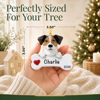Hand holding the personalized Jack Russell Christmas ornament to show its 3.50 inch width