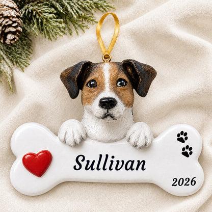 Personalized Jack Russell Dog Bone christmas ornament laid on a soft white knit blanket