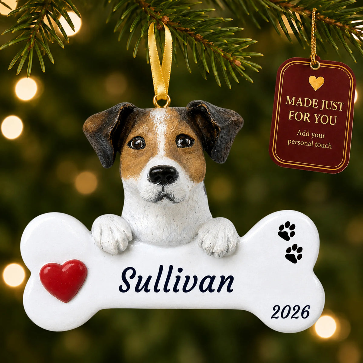 Jack Russell Dog Bone christmas ornament hanging on a lit Christmas tree with a Made Just For You gift tag