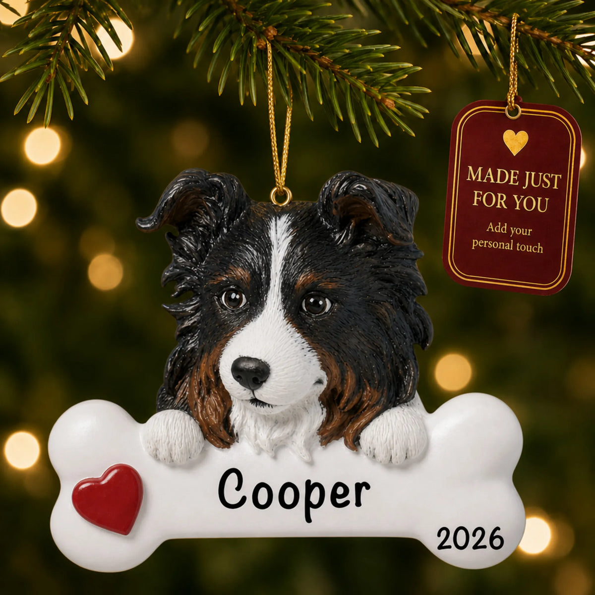 Personalized Australian shepherd Christmas ornament hanging on a lit tree beside a Made Just For You tag