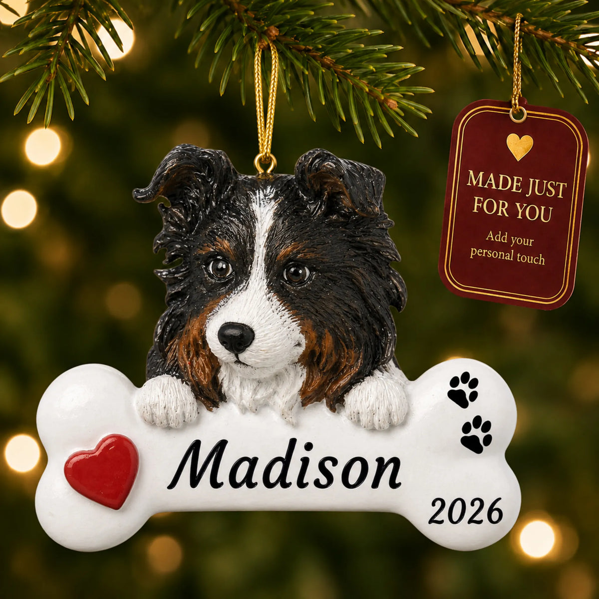 Australian Shepherd Dog Bone christmas ornament hanging on a lit Christmas tree with a Made Just For You gift tag