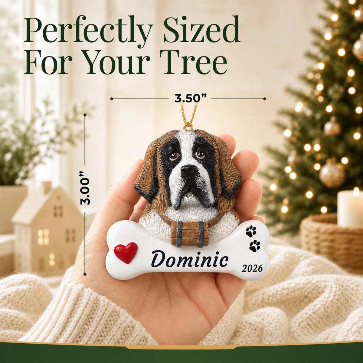 Size guide: the personalized St. Bernard Dog Bone christmas ornament is 3.50 in wide by 3.00 in tall, shown in hand