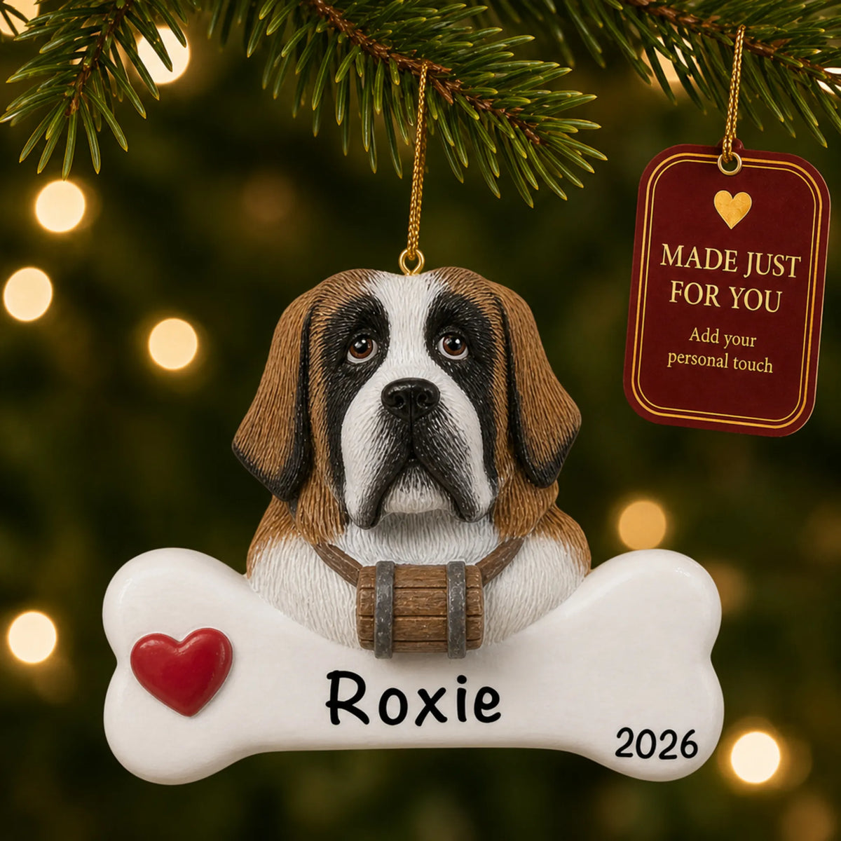 Personalized St. Bernard Christmas ornament hanging on a lit tree beside a Made Just For You tag