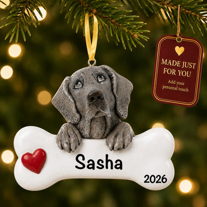 Personalized Weimaraner Christmas ornament hanging on a lit tree beside a Made Just For You tag