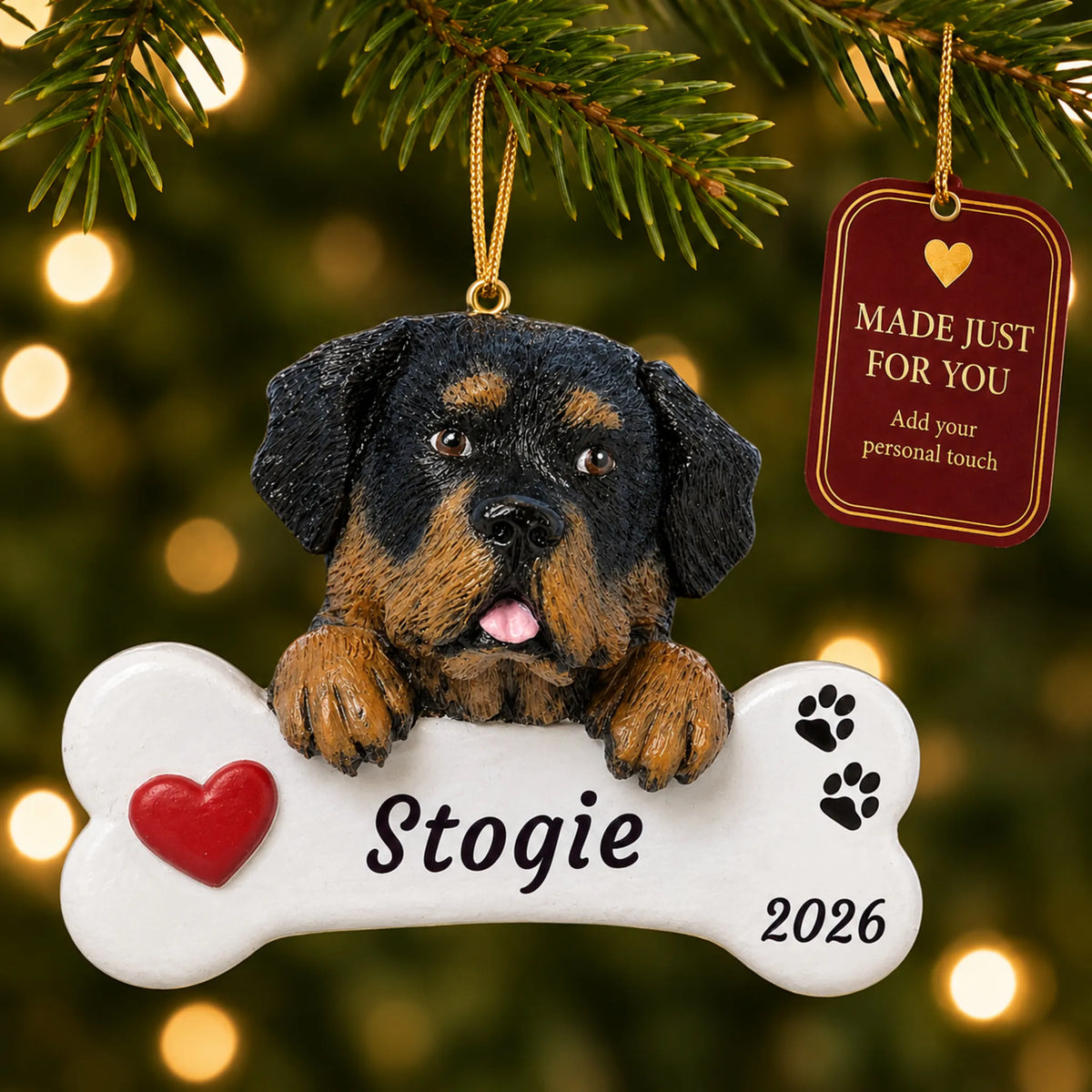Rottweiler Dog Bone christmas ornament hanging on a lit Christmas tree with a Made Just For You gift tag