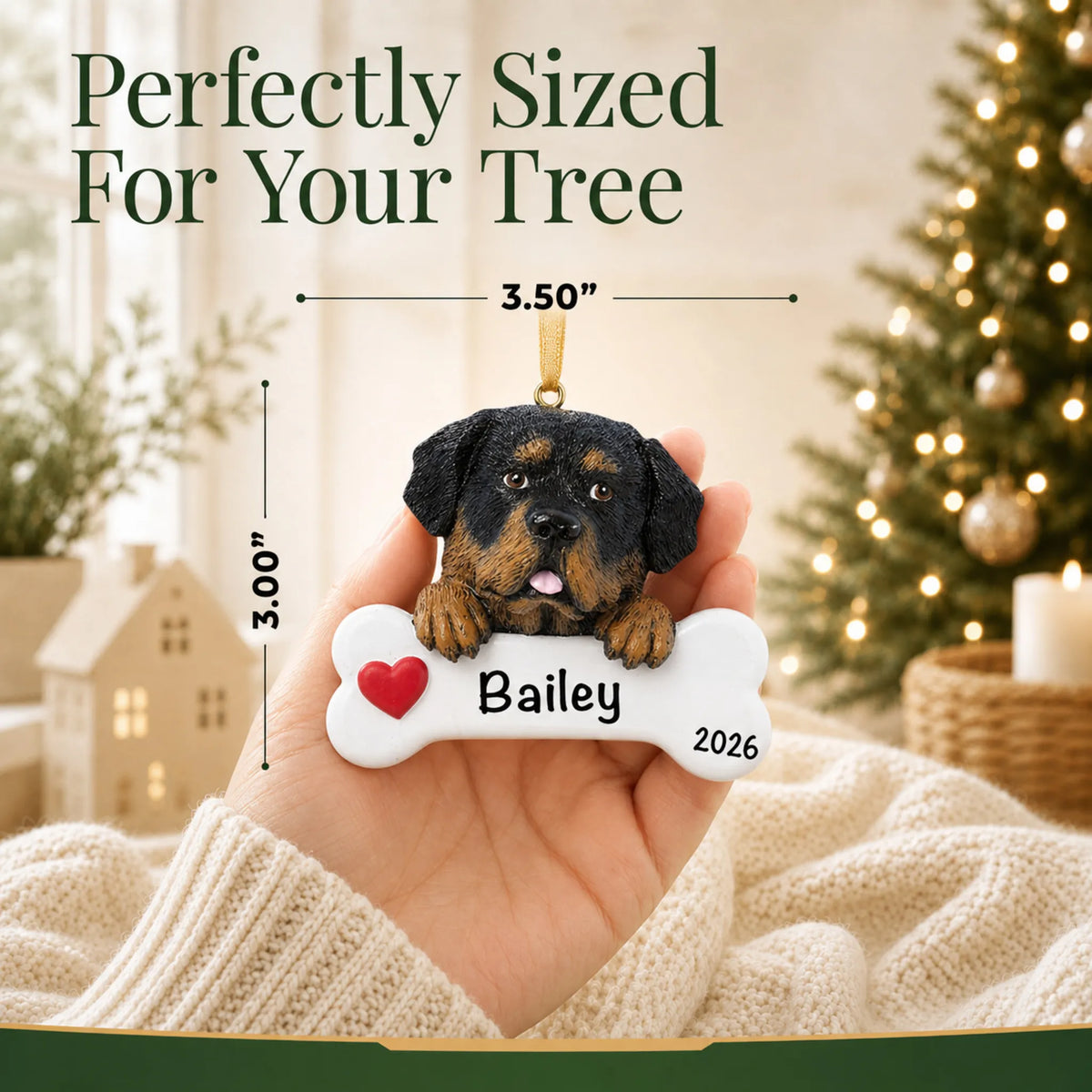 Hand holding the personalized Rottweiler Christmas ornament to show its 3.50 inch width