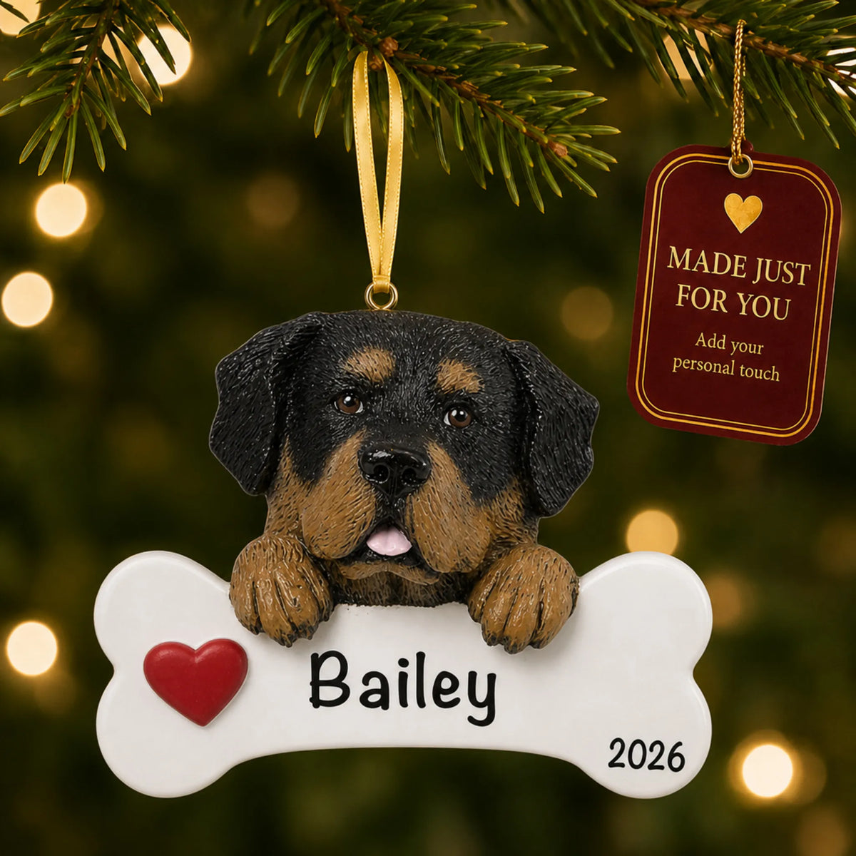 Personalized Rottweiler Christmas ornament hanging on a lit tree beside a Made Just For You tag