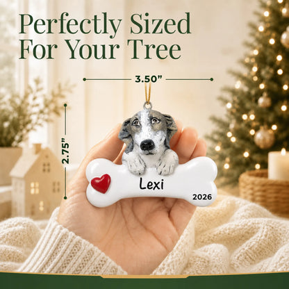 Hand holding the personalized greyhound Christmas ornament to show its 3.50 inch width