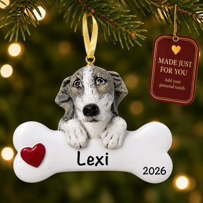 Personalized greyhound Christmas ornament hanging on a lit tree beside a Made Just For You tag