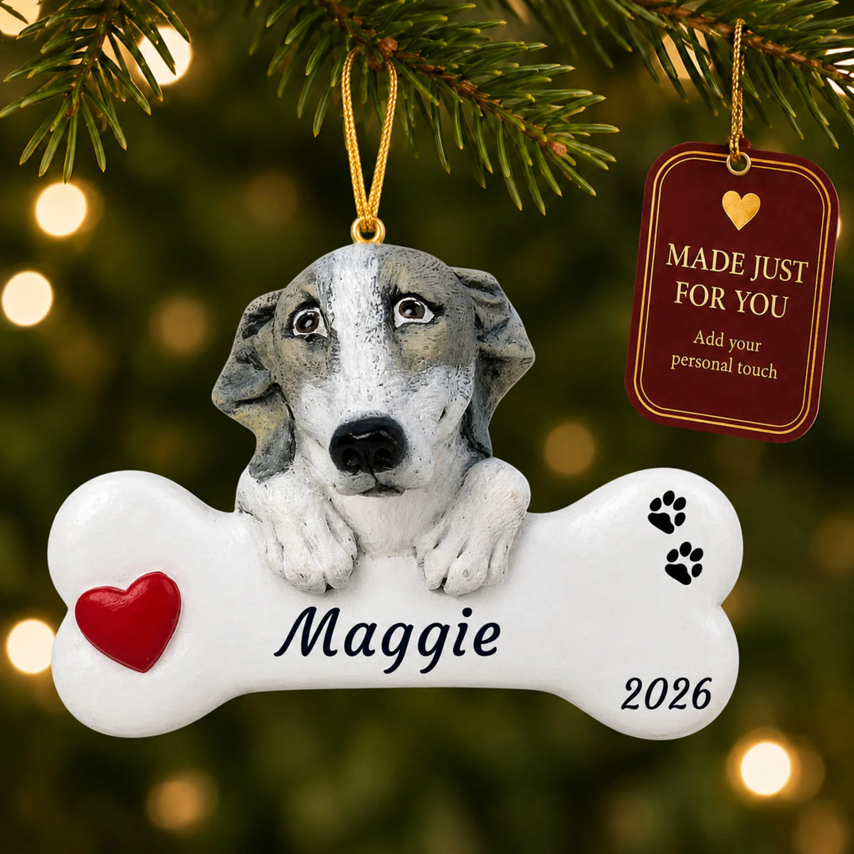 Greyhound Dog Bone christmas ornament hanging on a lit Christmas tree with a Made Just For You gift tag