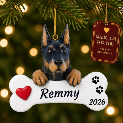 Doberman Pinscher Dog Bone christmas ornament hanging on a lit Christmas tree with a Made Just For You gift tag
