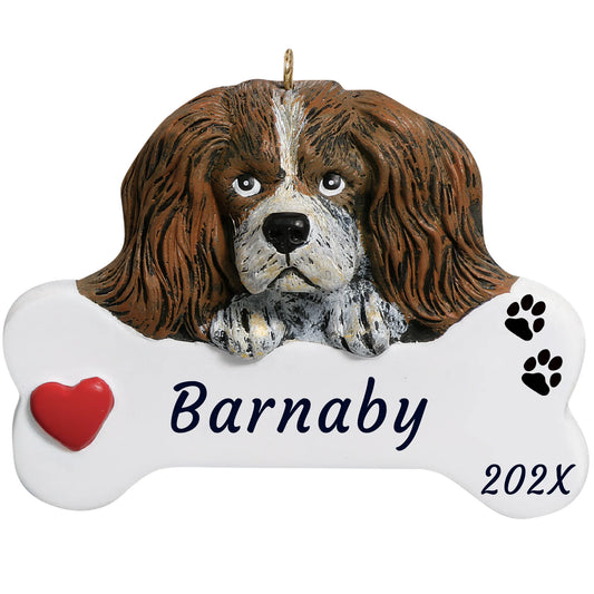 Personalized Cavalier King Charles dog bone Christmas ornament, a silky-eared spaniel on a white bone, name and year