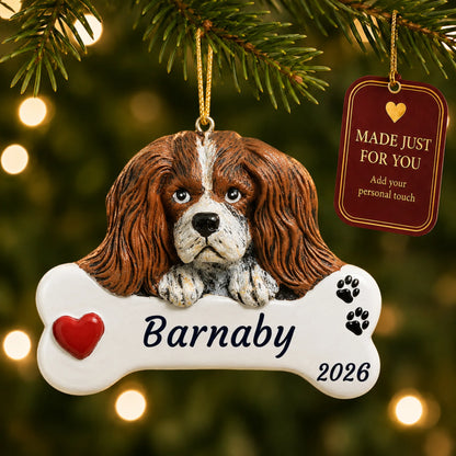 King Charles Cavalier Dog Bone christmas ornament hanging on a lit Christmas tree with a Made Just For You gift tag