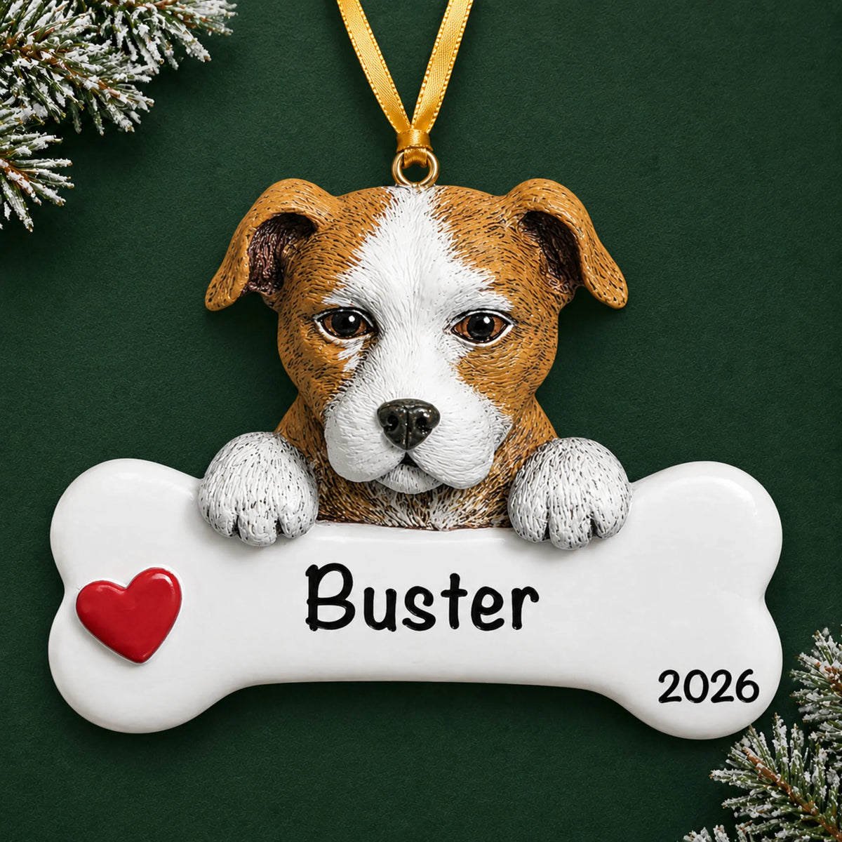 Personalized Staffordshire pit bull dog bone Christmas ornament, engraved with a name and year, on a green holiday backdrop