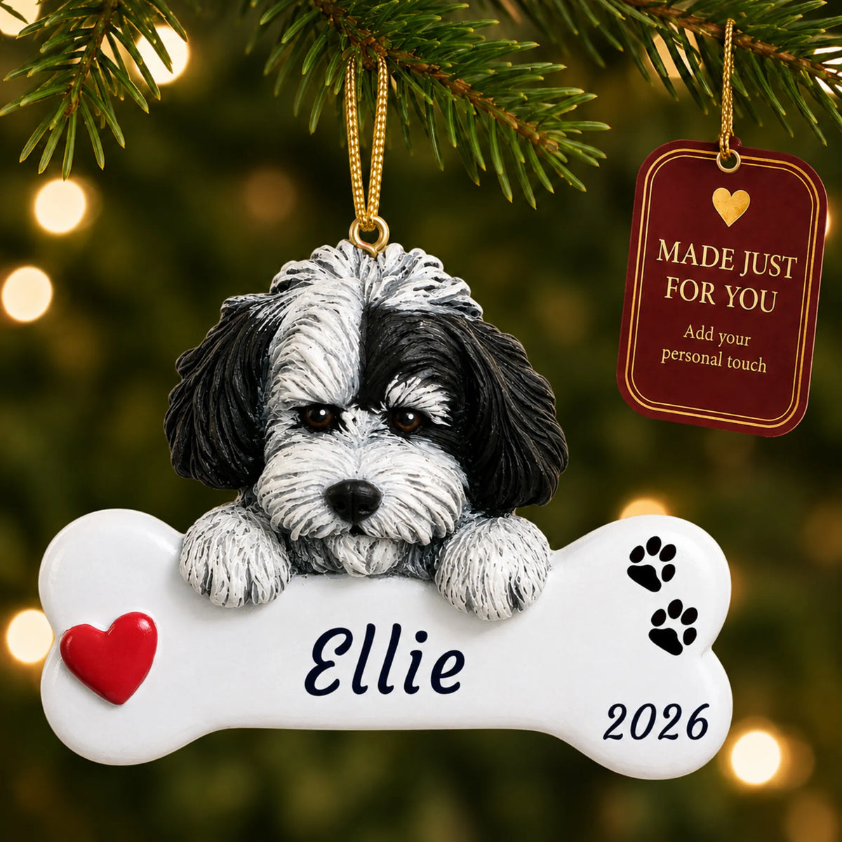 Havanese Dog Bone christmas ornament hanging on a lit Christmas tree with a Made Just For You gift tag
