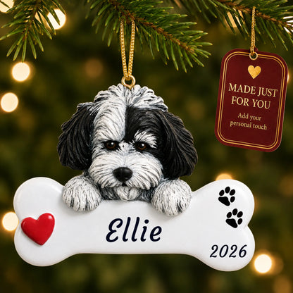 Havanese Dog Bone christmas ornament hanging on a lit Christmas tree with a Made Just For You gift tag