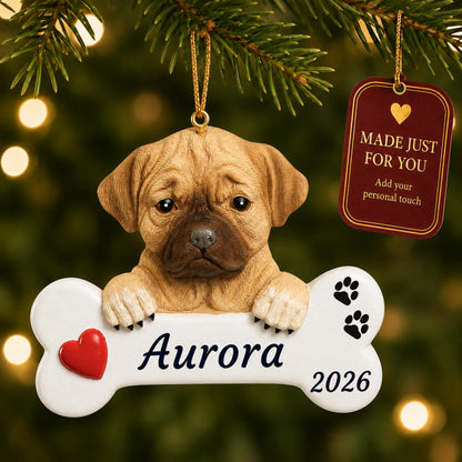 Puggle Dog Bone christmas ornament hanging on a lit Christmas tree with a Made Just For You gift tag