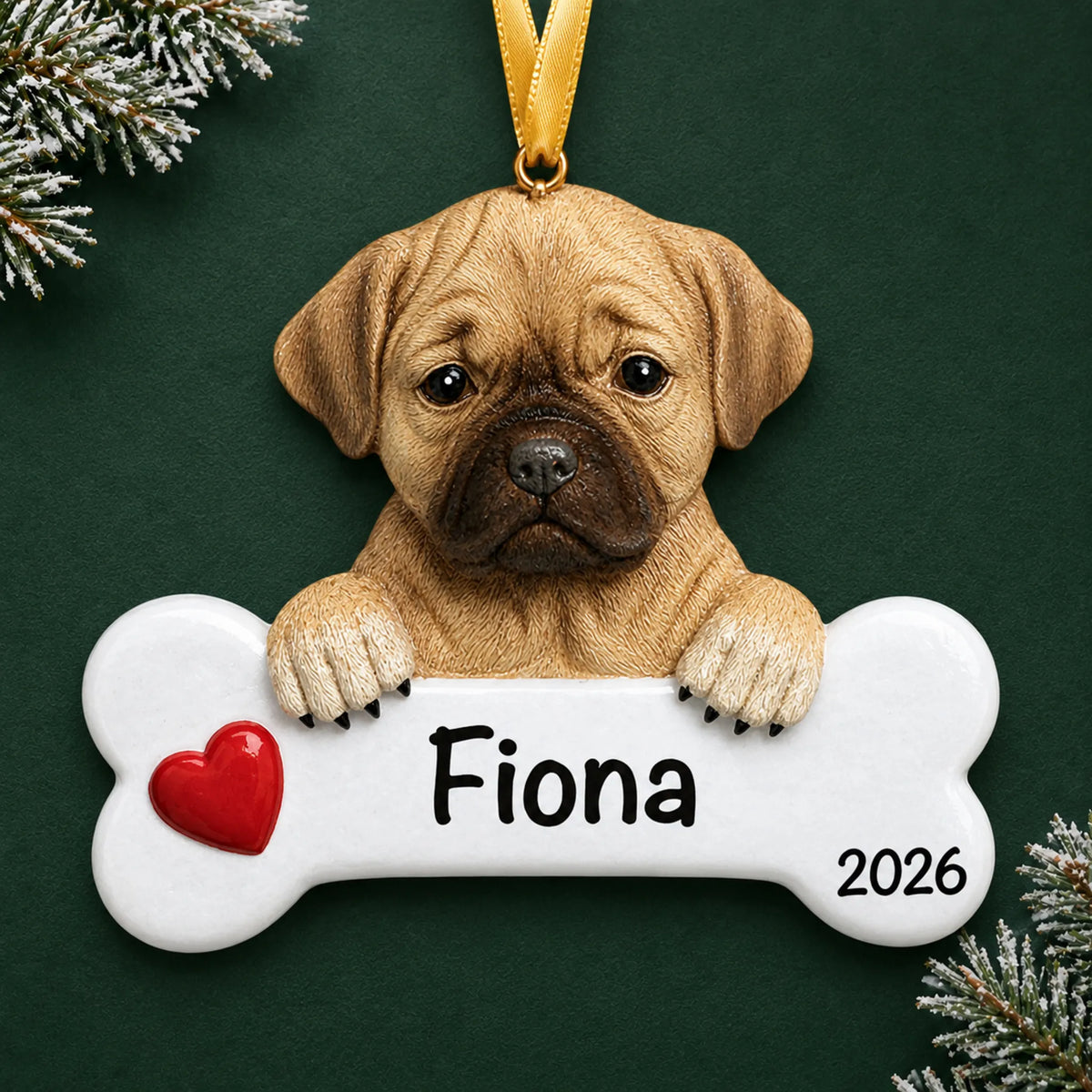 Personalized puggle dog bone Christmas ornament, engraved with a name and year, on a green holiday backdrop