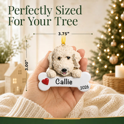Hand holding the personalized Labradoodle Christmas ornament to show its 3.75 inch width