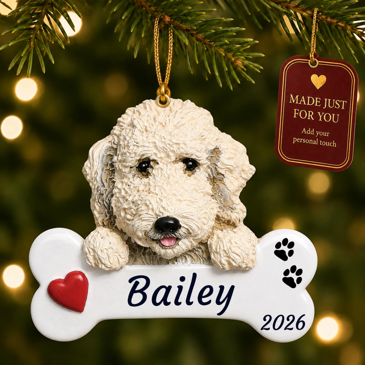 Labradoodle Dog Bone christmas ornament hanging on a lit Christmas tree with a Made Just For You gift tag