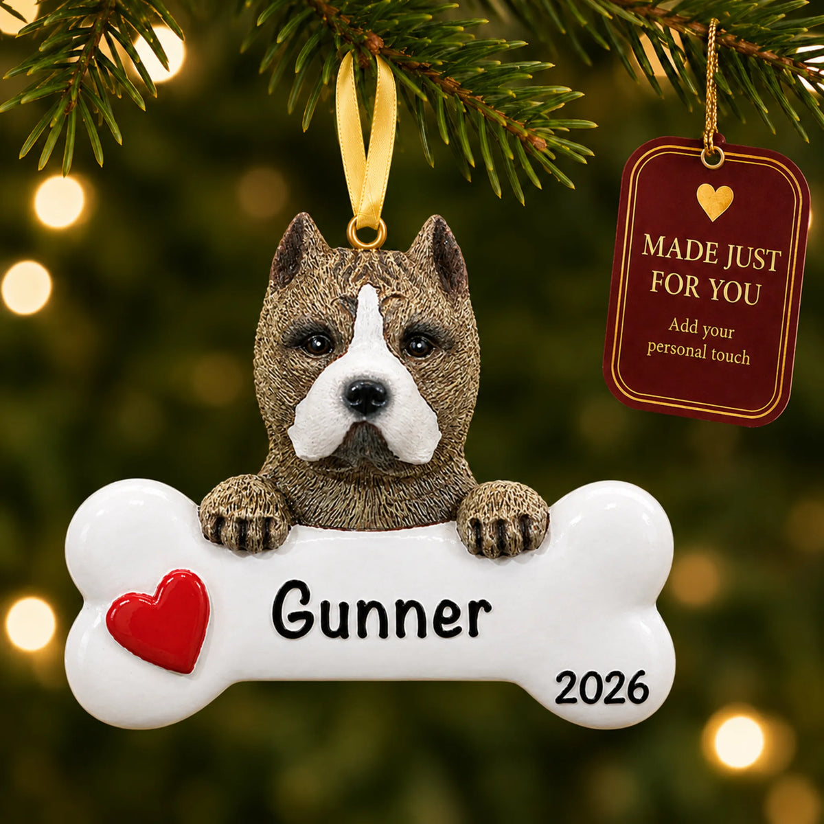 Personalized pit bull Christmas ornament hanging on a lit tree beside a Made Just For You tag