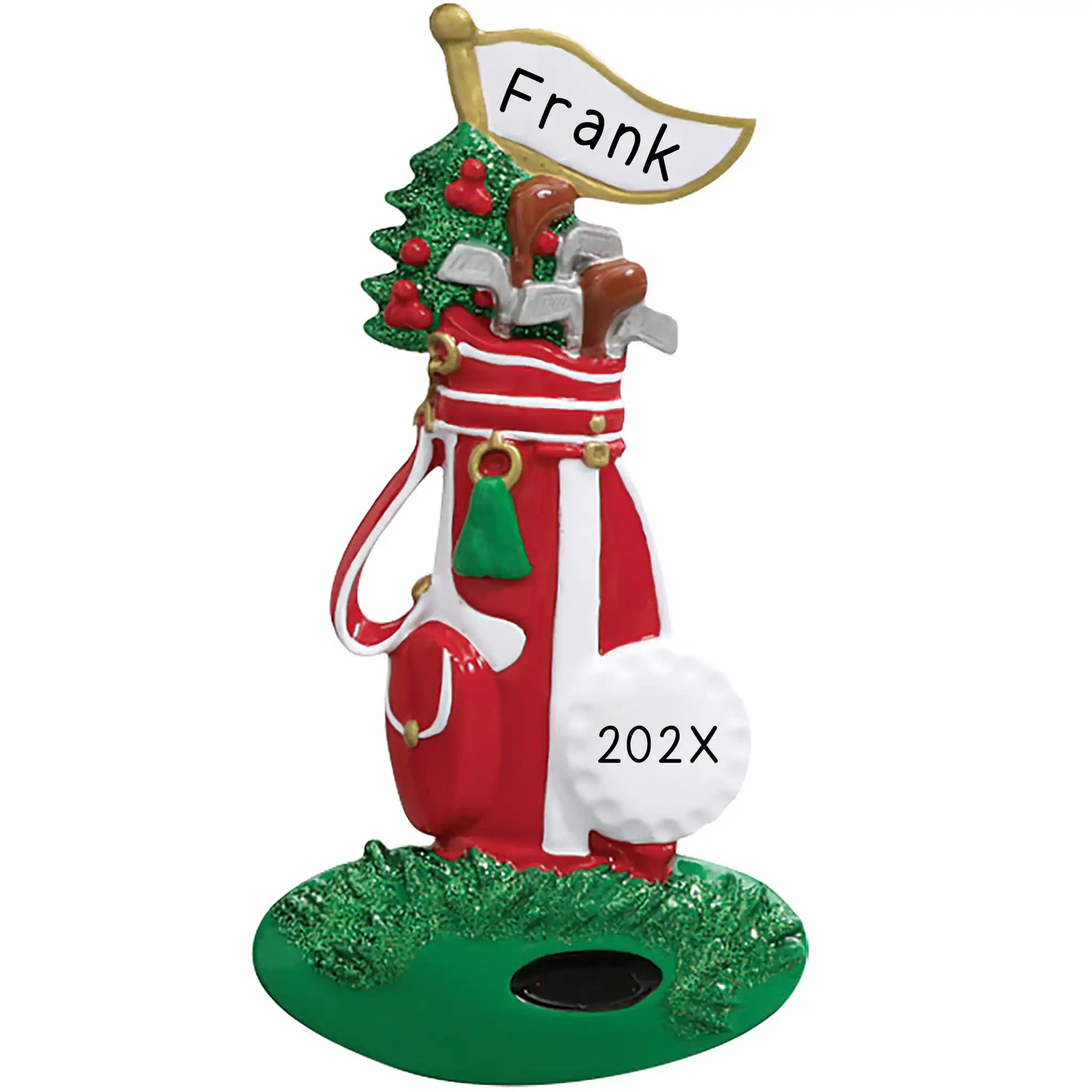 Personalized Christmas ornament shaped like a red and white golf bag filled with clubs and a miniature Christmas tree, standing on a green base with a blank white flag ready for custom name engraving.