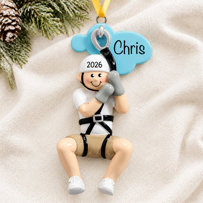 Personalized zip line boy christmas ornament laid on a soft white knit blanket