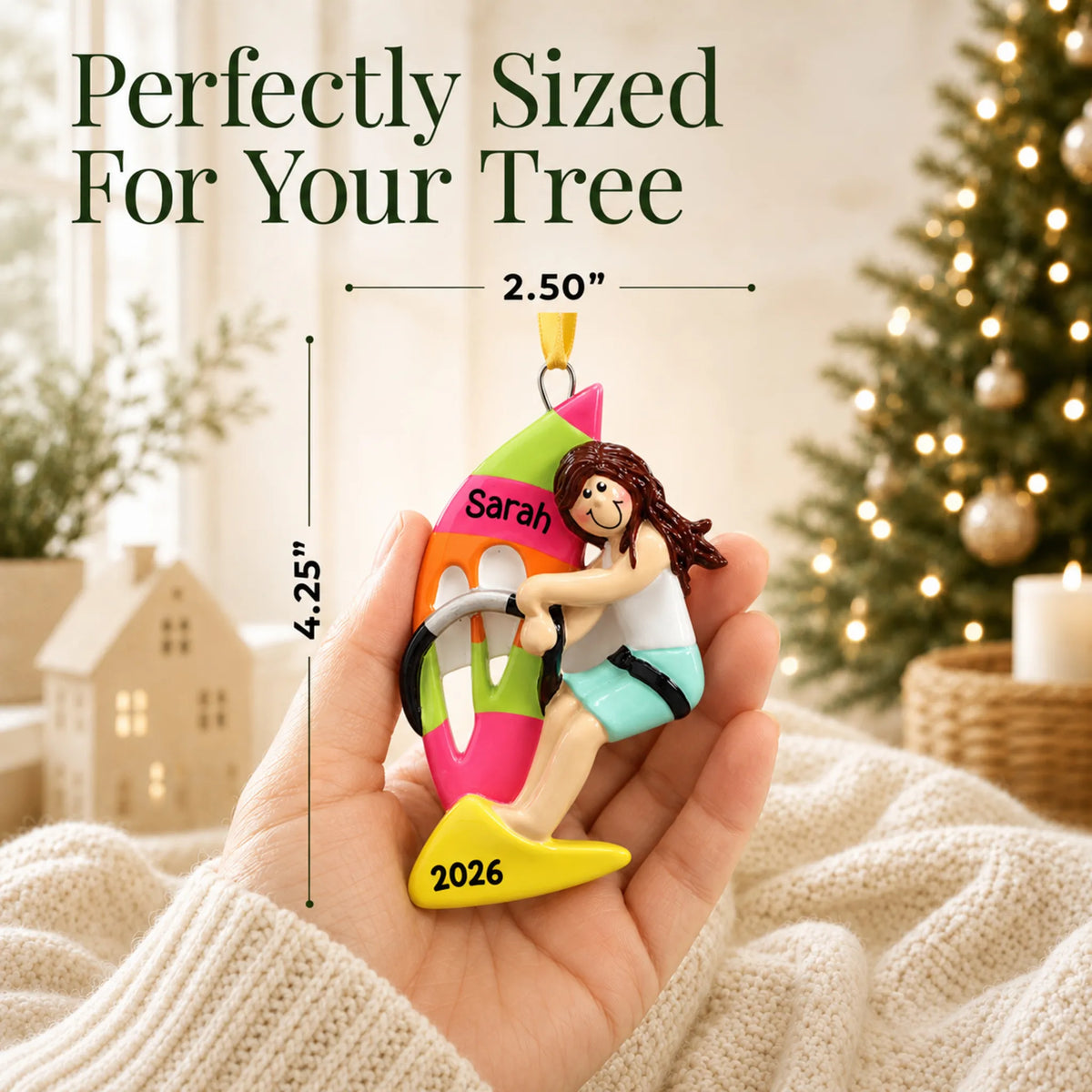 Size guide: the personalized windsurfing girl christmas ornament is 2.50 in wide by 4.25 in tall, shown in hand