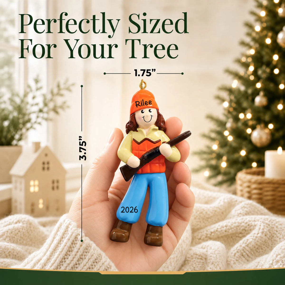 Size guide: the personalized hunting girl christmas ornament is 1.75 in wide by 3.75 in tall, shown in hand