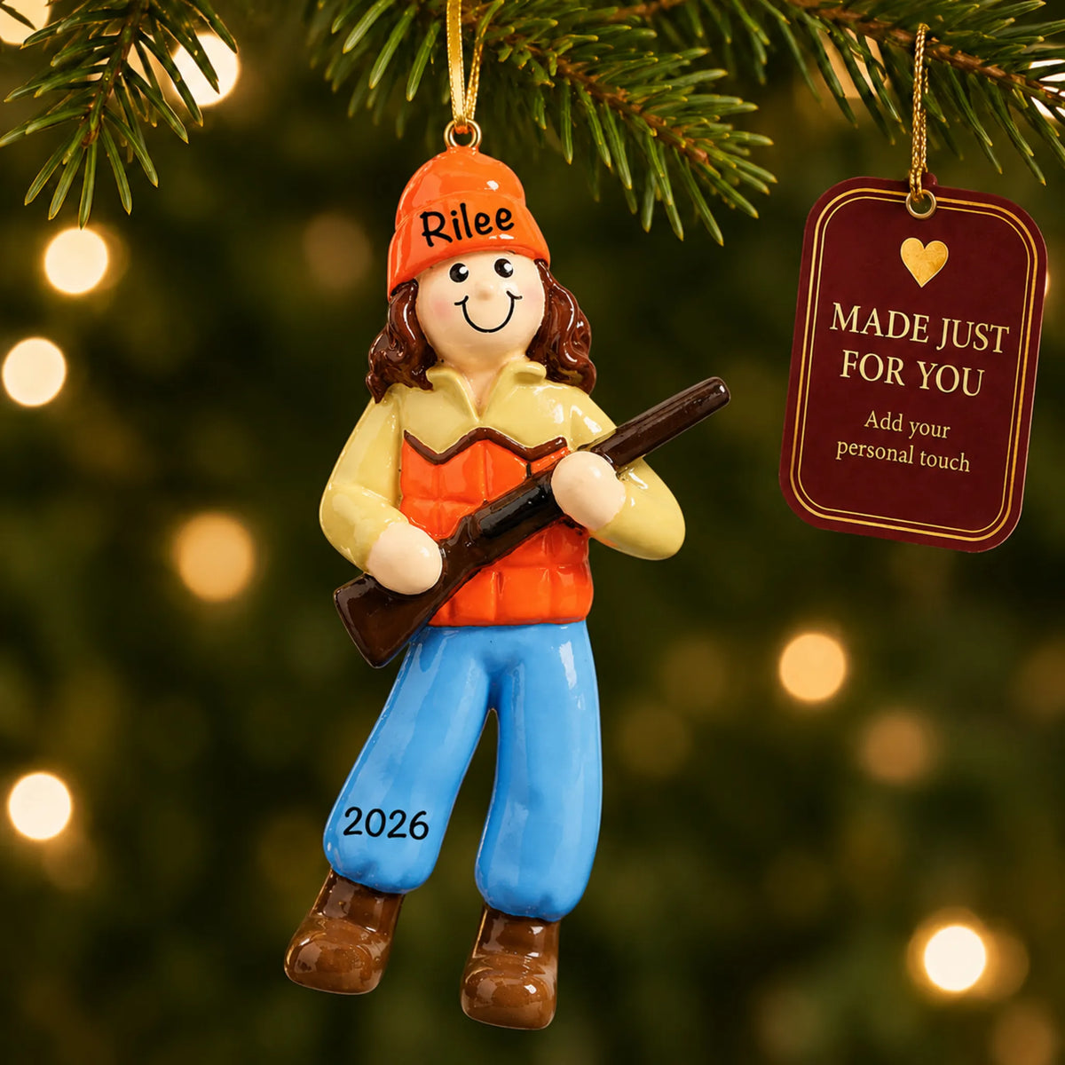 Hunting girl christmas ornament hanging on a lit Christmas tree with a Made Just For You gift tag