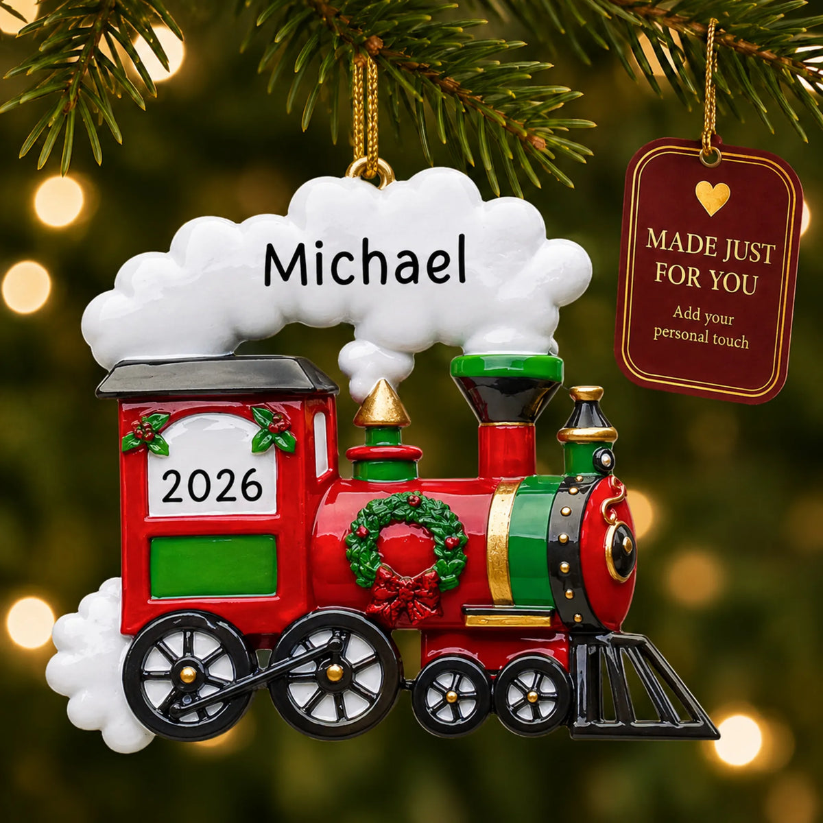 Holiday train christmas ornament hanging on a lit Christmas tree with a Made Just For You gift tag
