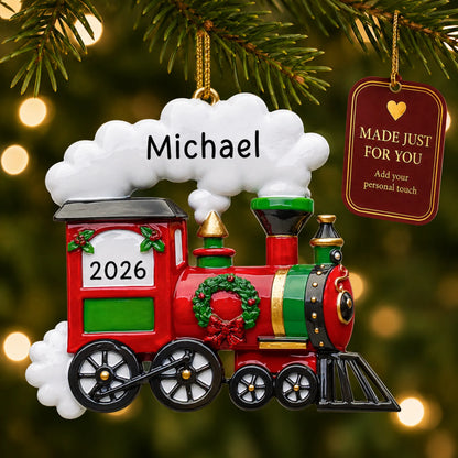 Holiday train christmas ornament hanging on a lit Christmas tree with a Made Just For You gift tag