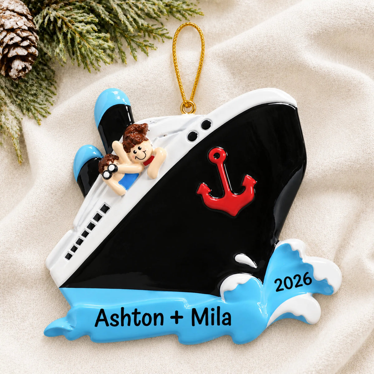 Personalized cruise ship couple christmas ornament laid on a soft white knit blanket