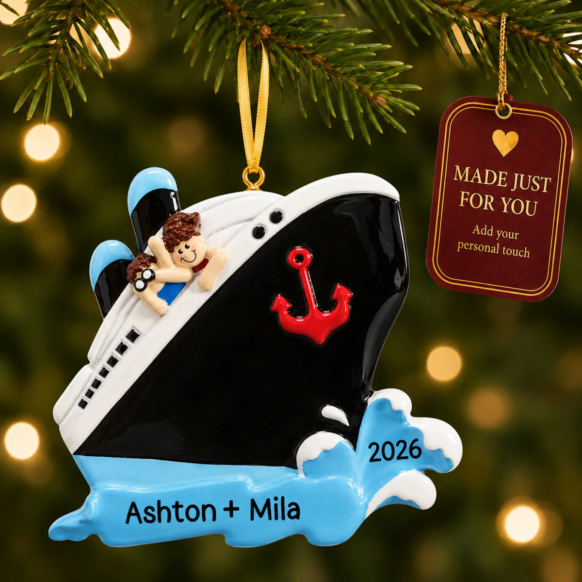 Cruise ship couple christmas ornament hanging on a lit Christmas tree with a Made Just For You gift tag