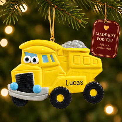 Dump truck christmas ornament hanging on a lit Christmas tree with a Made Just For You gift tag