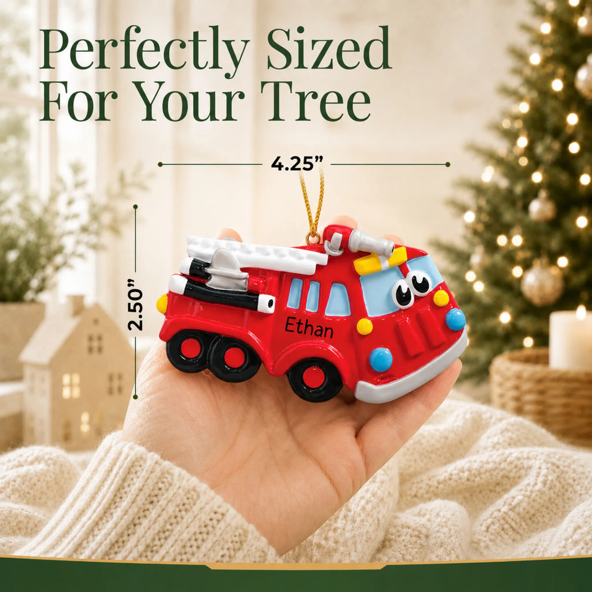 Size guide: the personalized fire truck christmas ornament is 4.25 in wide by 2.50 in tall, shown in hand