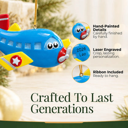 Hand-painted details and laser engraved personalization on the blue airplane christmas ornament, ribbon included