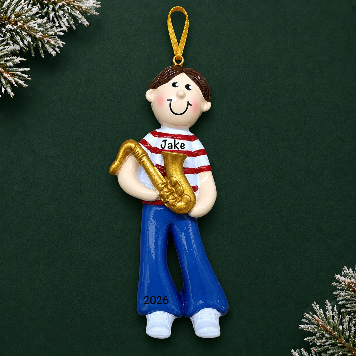 Personalized saxophone boy christmas ornament on a dark green pine background