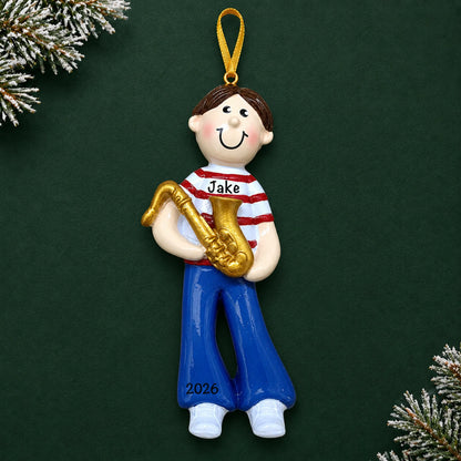 Personalized saxophone boy christmas ornament on a dark green pine background