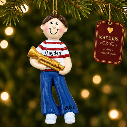 Trumpet boy christmas ornament hanging on a lit Christmas tree with a Made Just For You gift tag
