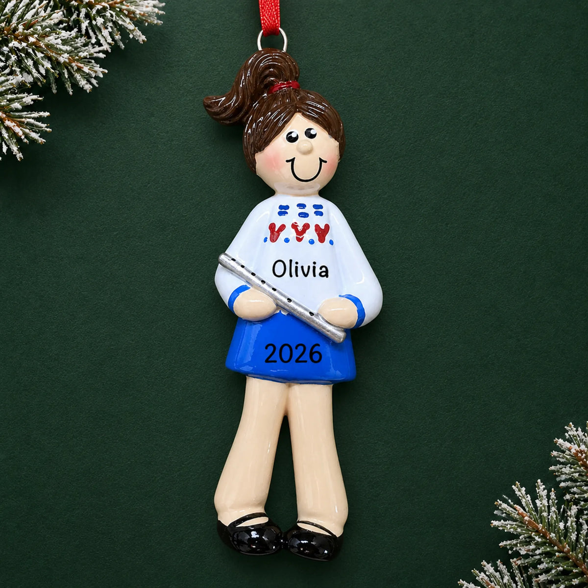 Personalized flute girl christmas ornament on a dark green pine background